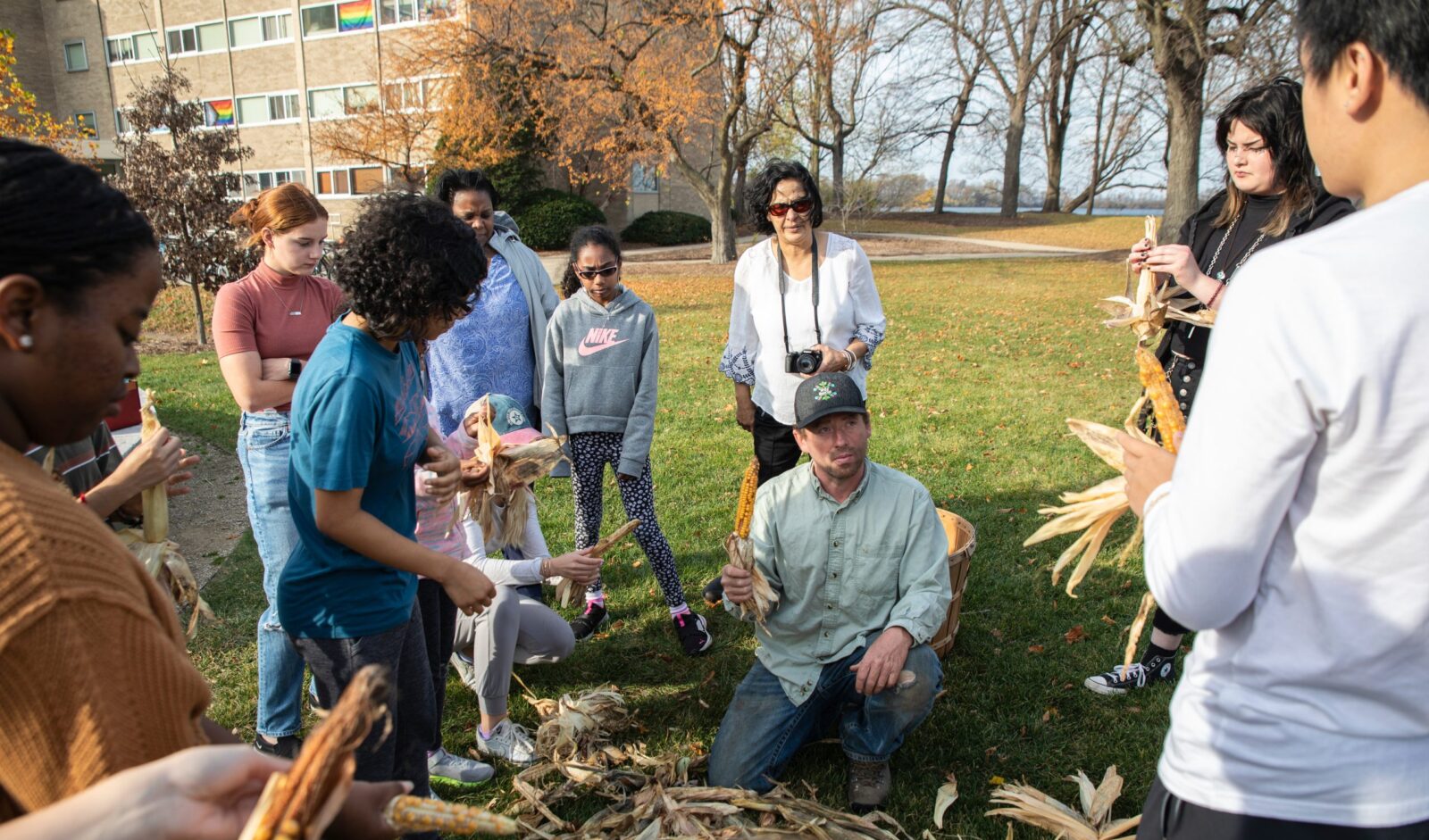 Members of the Ho Chunk Nation, volunteers, and campus community members experience the building of a Ciiporoke, a Ho-Chunk dwelling, as well as participate in making traditional foods and baskets on the North Lawn of Dejope at the University of Wisconsin–Madison