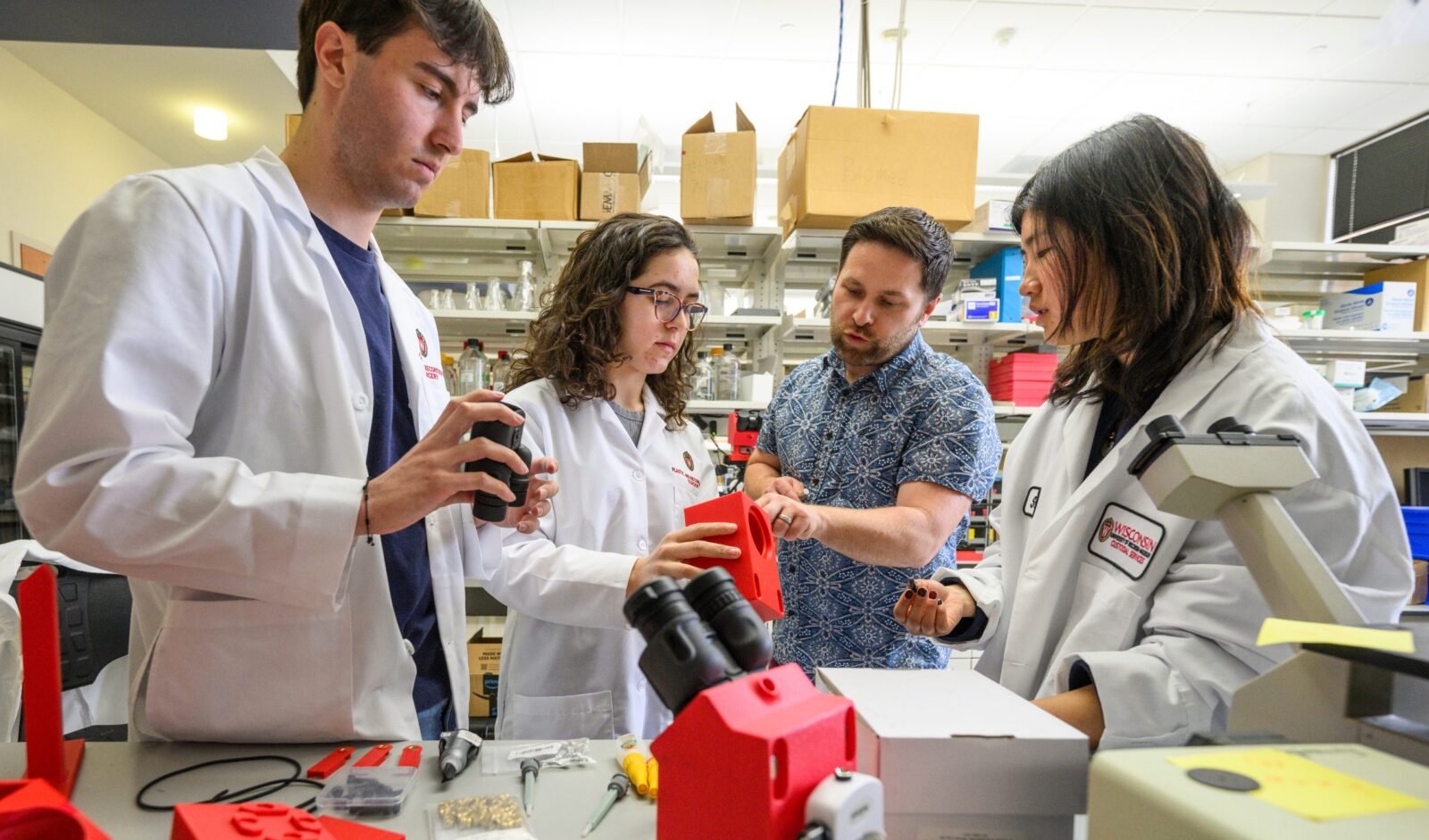 Students and professor do research at the Microsurgery and Regenerative Medicine Laboratory in the Department of Surgery at the University of Wisconsin–Madison.