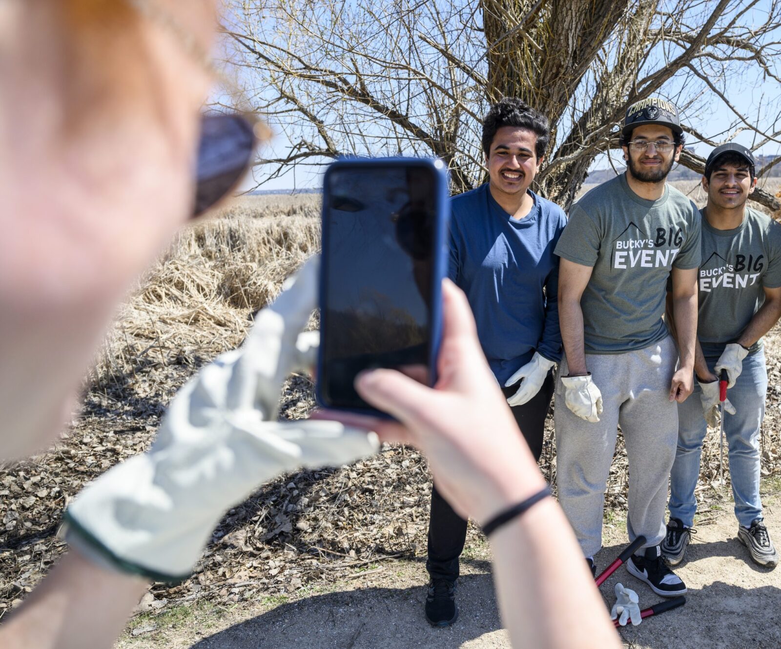 Student volunteers pose with Chancellor Jennifer Mnookin during Bucky’s Big Event (a service day where students, staff, and faculty can volunteer and engage with the community) at the Lakeshore Preserve at the University of Wisconsin–Madison.