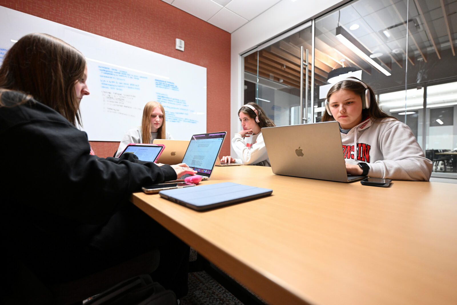 Students study on their laptops