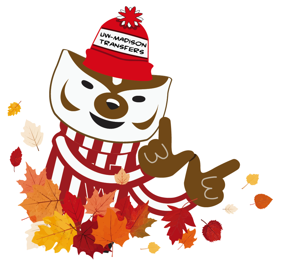 Bucky Badger in a Transfer hat peeking out of a pile of leaves